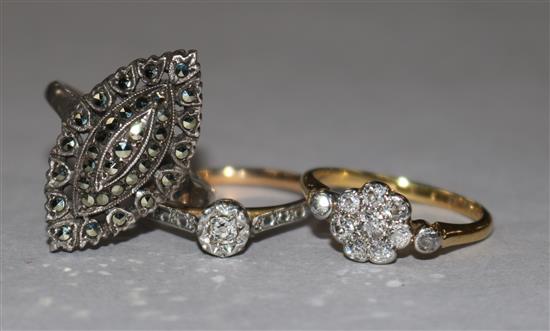 An 18ct gold and diamond cluster ring, a 9ct gold, platinum and diamond illusion-set ring and a silver and marcasite ring